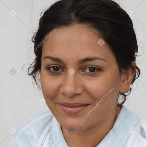 Joyful latino adult female with medium  brown hair and brown eyes