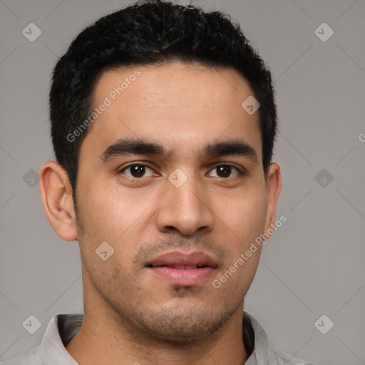 Joyful latino young-adult male with short  black hair and brown eyes