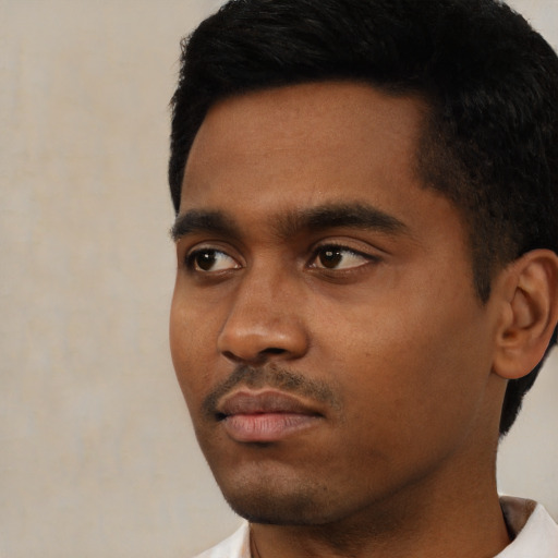 Neutral latino young-adult male with short  black hair and brown eyes
