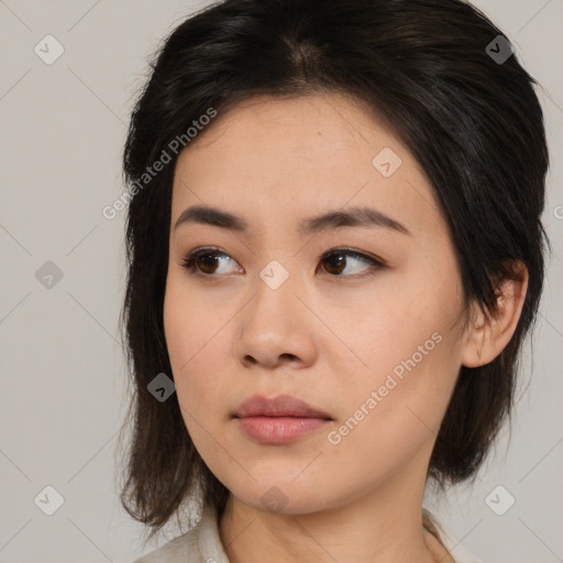 Neutral asian young-adult female with medium  brown hair and brown eyes