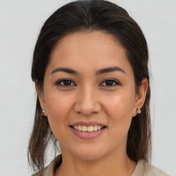 Joyful white young-adult female with medium  brown hair and brown eyes