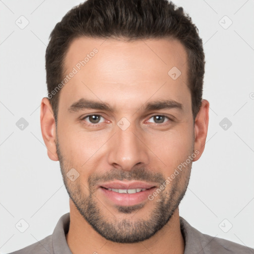 Joyful white young-adult male with short  brown hair and brown eyes