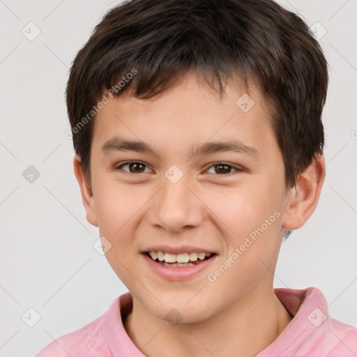 Joyful white child male with short  brown hair and brown eyes