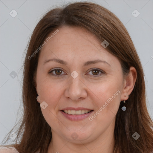 Joyful white adult female with long  brown hair and brown eyes