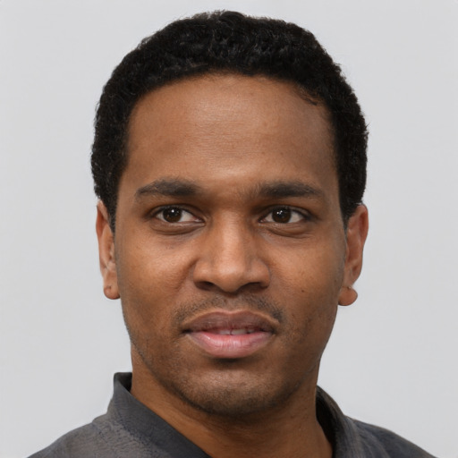 Neutral black young-adult male with short  black hair and brown eyes