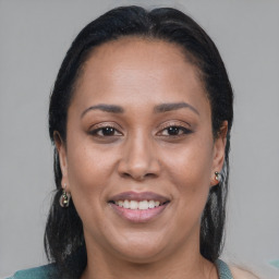 Joyful black young-adult female with medium  brown hair and brown eyes