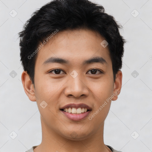 Joyful asian young-adult male with short  black hair and brown eyes