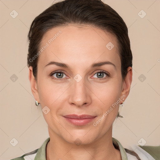 Joyful white adult female with short  brown hair and grey eyes