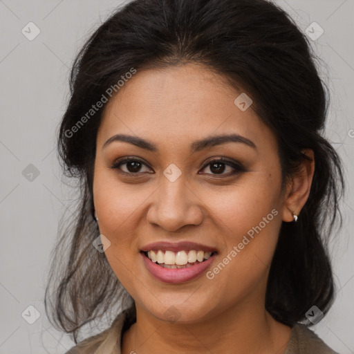 Joyful latino young-adult female with long  brown hair and brown eyes