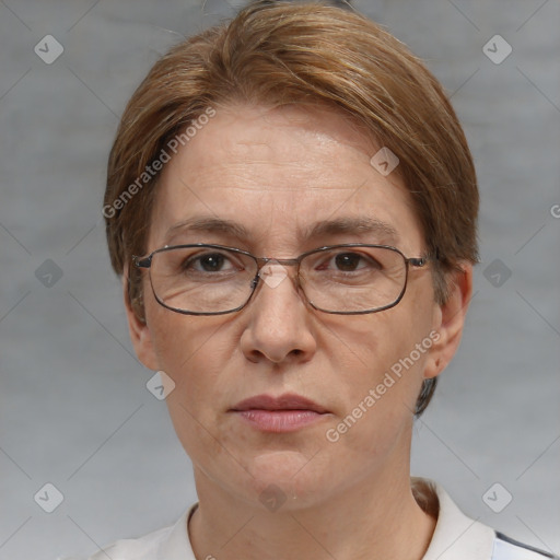 Joyful white adult female with short  brown hair and grey eyes