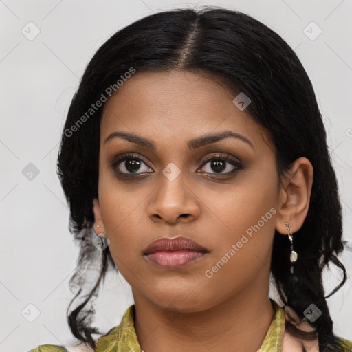 Joyful black young-adult female with medium  brown hair and brown eyes