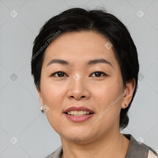 Joyful asian young-adult female with short  black hair and brown eyes