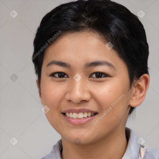 Joyful asian young-adult female with short  brown hair and brown eyes