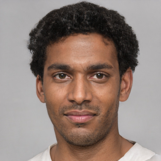 Neutral black young-adult male with short  black hair and brown eyes