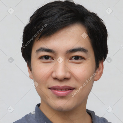 Joyful asian young-adult male with short  black hair and brown eyes