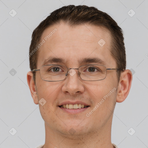 Joyful white adult male with short  brown hair and brown eyes