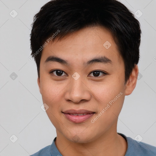 Joyful asian young-adult male with short  brown hair and brown eyes