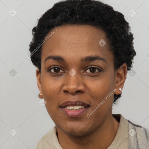 Joyful black young-adult female with short  black hair and brown eyes