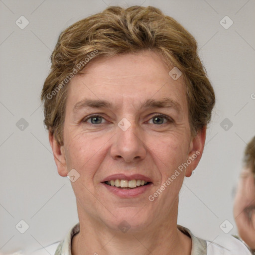 Joyful white adult female with short  brown hair and grey eyes