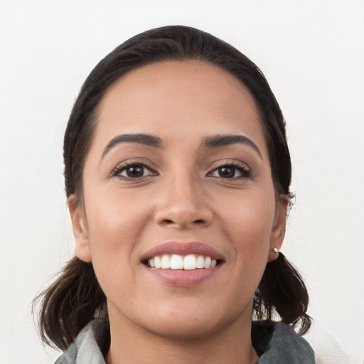 Joyful white young-adult female with medium  black hair and brown eyes