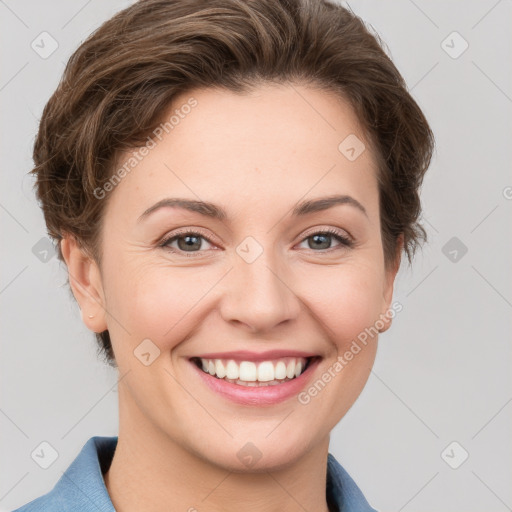 Joyful white young-adult female with short  brown hair and grey eyes