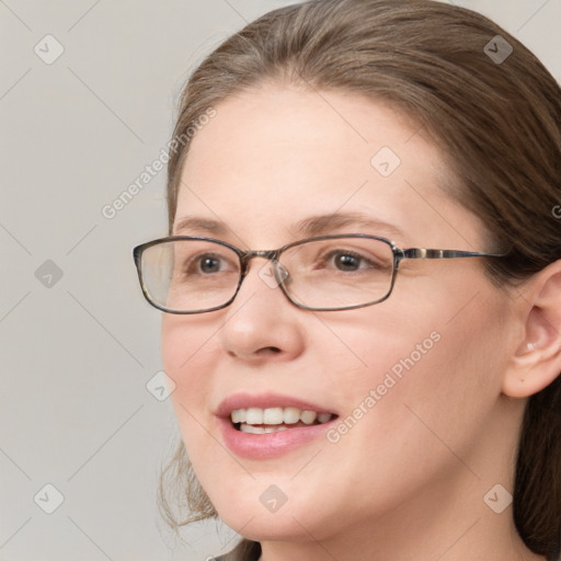 Joyful white adult female with medium  brown hair and blue eyes