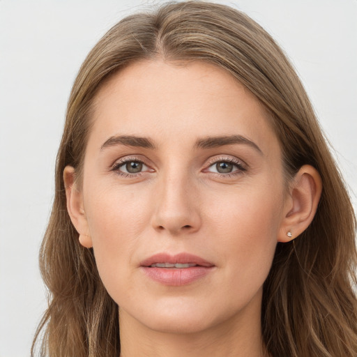 Joyful white young-adult female with long  brown hair and grey eyes