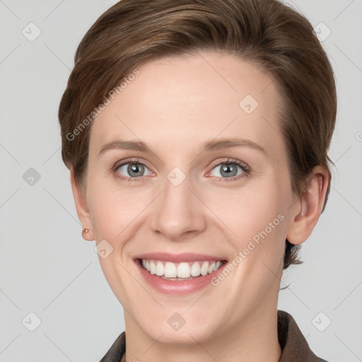 Joyful white young-adult female with short  brown hair and grey eyes