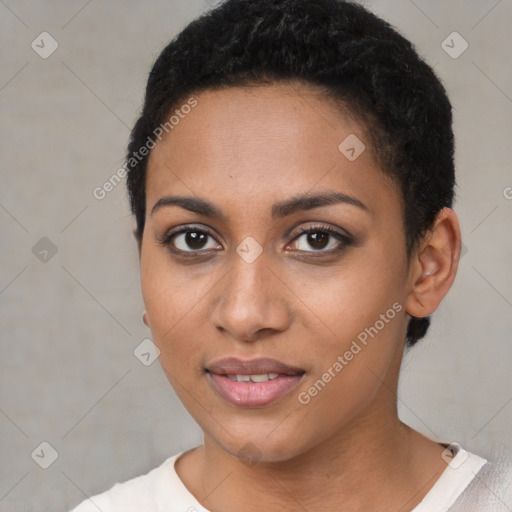 Joyful black young-adult female with short  brown hair and brown eyes