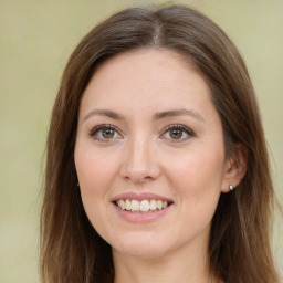 Joyful white young-adult female with long  brown hair and green eyes