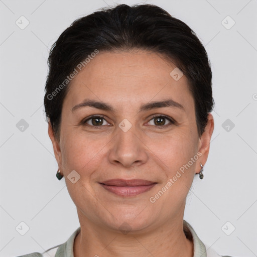 Joyful white adult female with short  brown hair and brown eyes