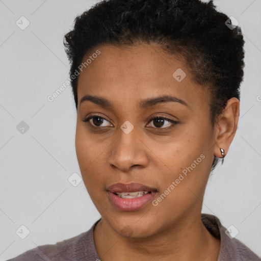 Joyful black young-adult female with short  brown hair and brown eyes