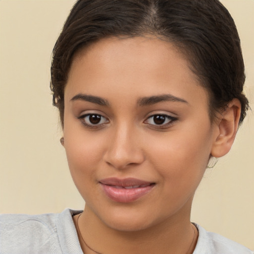 Joyful latino young-adult female with short  brown hair and brown eyes