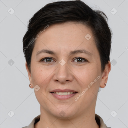 Joyful white adult female with short  brown hair and brown eyes