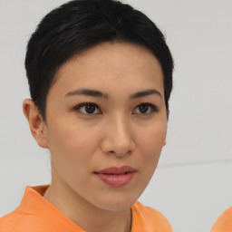 Joyful asian young-adult female with short  brown hair and brown eyes