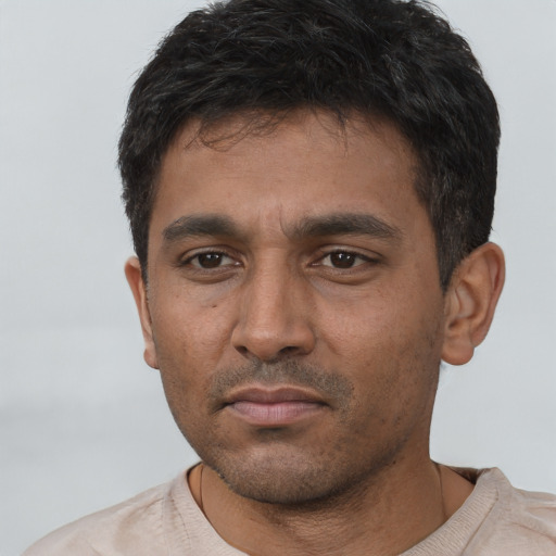 Neutral white young-adult male with short  black hair and brown eyes