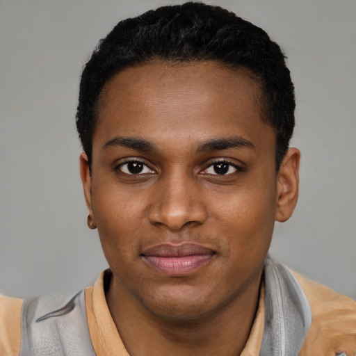 Joyful black young-adult male with short  black hair and brown eyes
