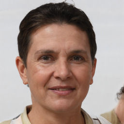 Joyful white adult female with short  brown hair and brown eyes