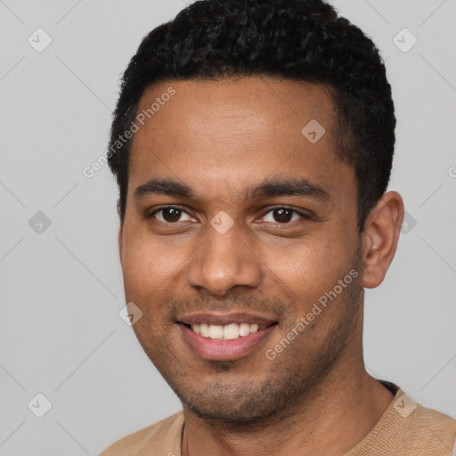 Joyful black young-adult male with short  black hair and brown eyes