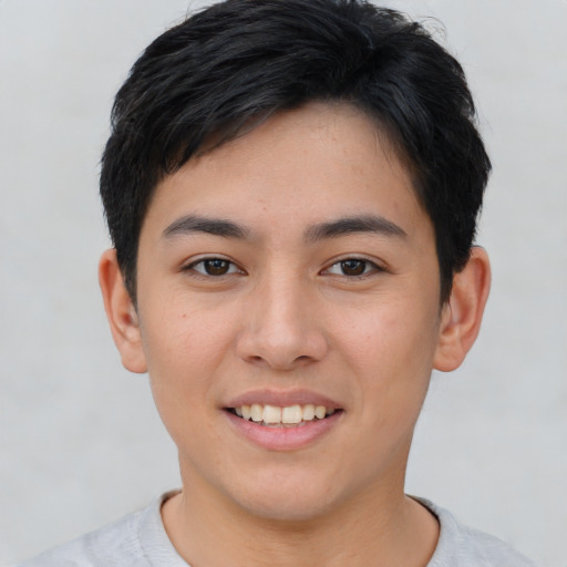 Joyful asian young-adult male with short  black hair and brown eyes