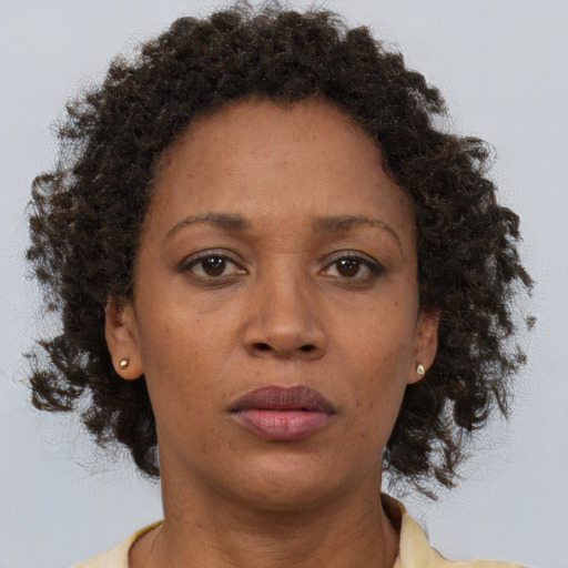 Neutral black adult female with short  brown hair and brown eyes