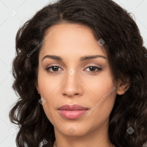 Joyful latino young-adult female with long  brown hair and brown eyes