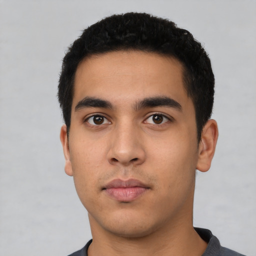 Neutral latino young-adult male with short  black hair and brown eyes