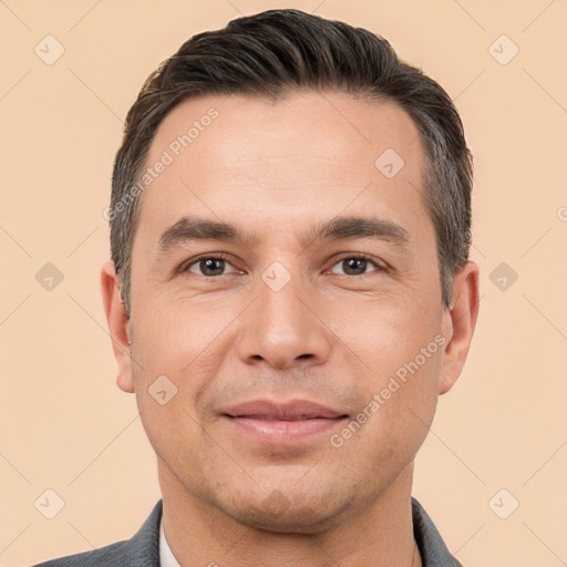 Joyful white adult male with short  brown hair and brown eyes