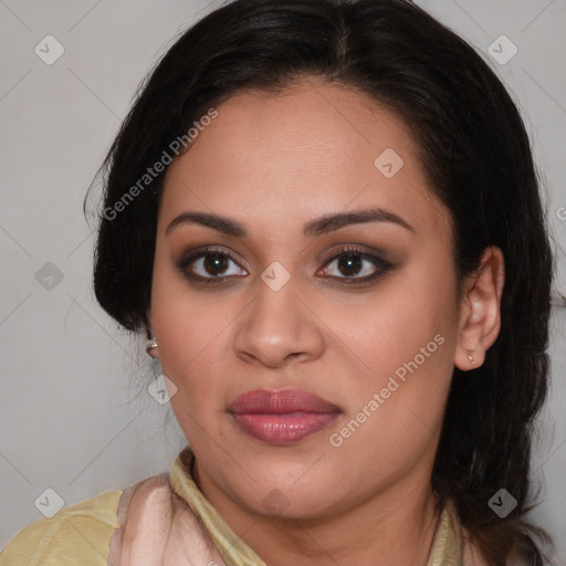 Joyful latino young-adult female with medium  brown hair and brown eyes