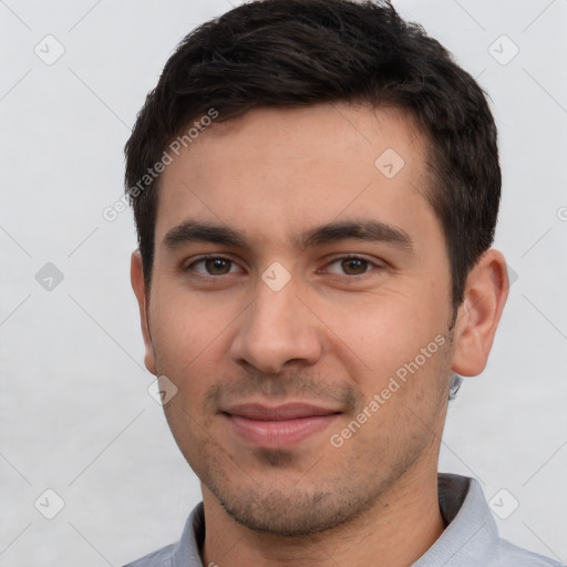 Joyful white young-adult male with short  black hair and brown eyes