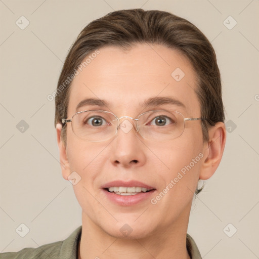 Joyful white adult female with short  brown hair and grey eyes