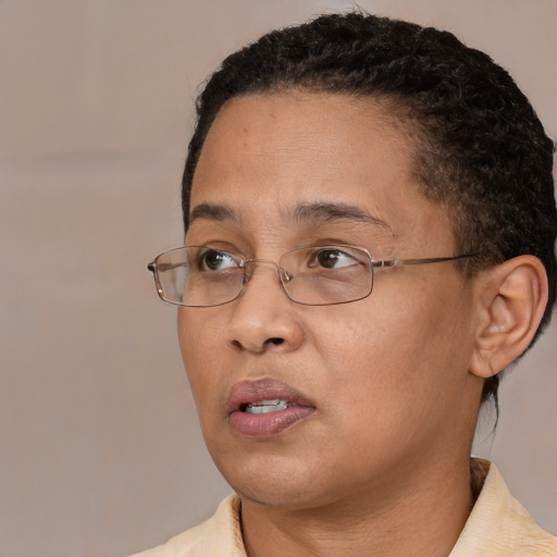 Neutral latino adult female with short  brown hair and brown eyes