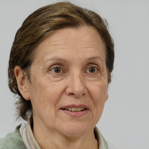 Joyful white middle-aged female with medium  brown hair and brown eyes