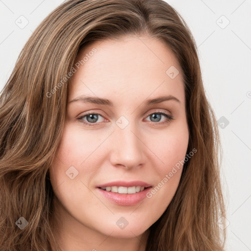 Joyful white young-adult female with long  brown hair and green eyes